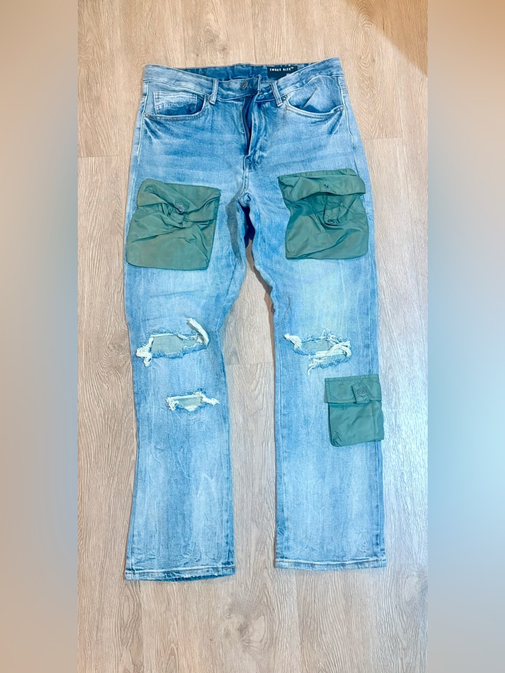 Smoke Rise distressed jeans with cargo pockets for men. Size 32 waist